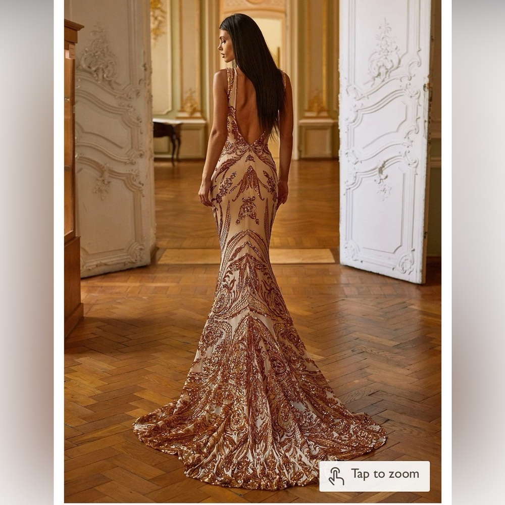 Backless, low V-neck sequenced prom dress with abstract design all around.